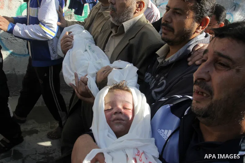 Palestinians carry the bodies of brothers Suhaib, 2-years-old, and Mohammed Hejazi, 4-years-old, during their funeral in the northern Gaza Strip area of Biet Lahia, on November 20, 2012. Four members of the Hejazi family...