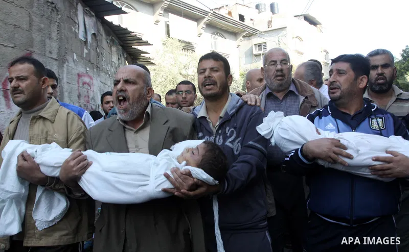 Palestinians carry the bodies of brothers Suhaib, 2-years-old, and Mohammed Hejazi, 4-years-old, during their funeral in the northern Gaza Strip area of Biet Lahia, on November 20, 2012. Four members of the Hejazi family...