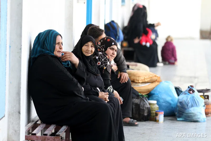 Displaced Palestinians from al-Atatra area, whose fled their house, gather in their temporary residence, at a United Nations-run school in Gaza City, on November 20, 2012. Israeli leaders discussed an Egyptian plan for a...