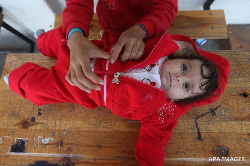 Displaced Palestinian children from the al-Attar area, whose fled their house, play in a classroom, their temporary residence, at a United Nations-run school in Gaza City, on November 20, 2012. Israeli leaders discussed...