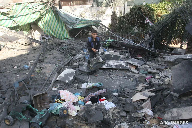 Palestinians inspect damaged buildings following Israeli air strikes on the southern Gaza Strip town of Rafah on November 20, 2012. The Israeli military said it attacked about 100 targets in the coastal strip during the...