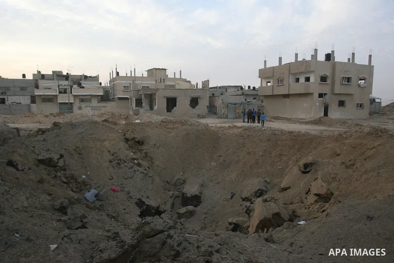 Palestinians inspect damaged tunnel following Israeli air strikes on the southern Gaza Strip town of Rafah on November 20, 2012. The Israeli military said it attacked about 100 targets in the coastal strip during the nig...