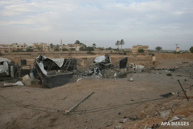 Palestinians inspect damaged tunnel following Israeli air strikes on the southern Gaza Strip town of Rafah on November 20, 2012. The Israeli military said it attacked about 100 targets in the coastal strip during the nig...