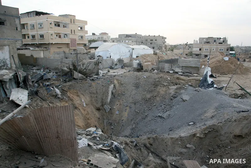 Palestinians inspect damaged tunnel following Israeli air strikes on the southern Gaza Strip town of Rafah on November 20, 2012. The Israeli military said it attacked about 100 targets in the coastal strip during the nig...