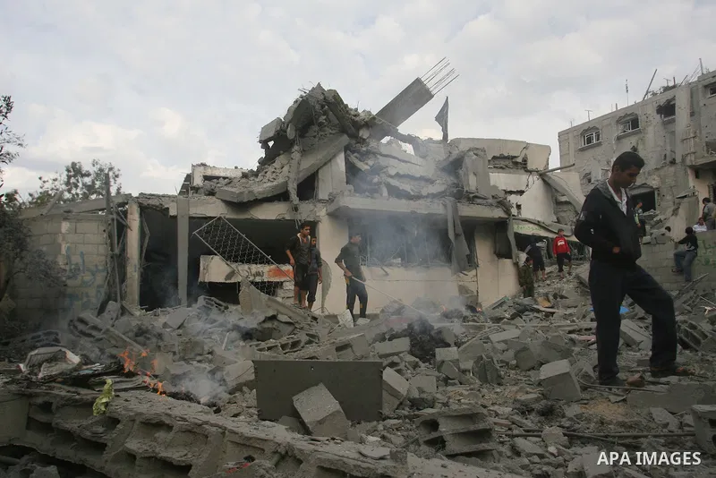 Palestinians inspect damaged tunnel following Israeli air strikes on the southern Gaza Strip town of Rafah on November 20, 2012. The Israeli military said it attacked about 100 targets in the coastal strip during the nig...