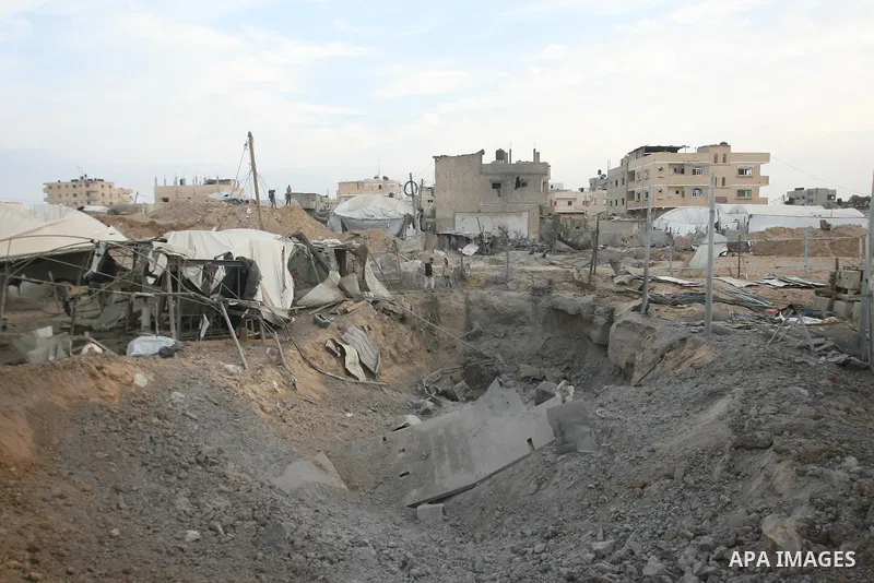 Palestinians inspect damaged tunnel following Israeli air strikes on the southern Gaza Strip town of Rafah on November 20, 2012. The Israeli military said it attacked about 100 targets in the coastal strip during the nig...