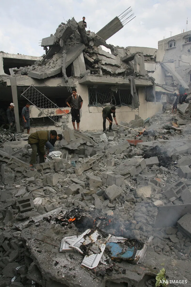 Palestinians inspect damaged buildings following Israeli air strikes on the southern Gaza Strip town of Rafah on November 20, 2012. The Israeli military said it attacked about 100 targets in the coastal strip during the...