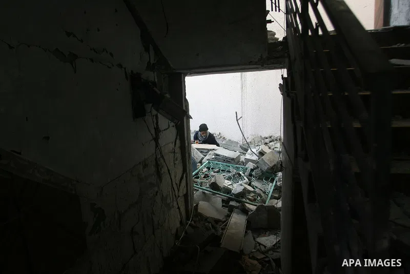 Palestinians inspect damaged buildings following Israeli air strikes on the southern Gaza Strip town of Rafah on November 20, 2012. The Israeli military said it attacked about 100 targets in the coastal strip during the...