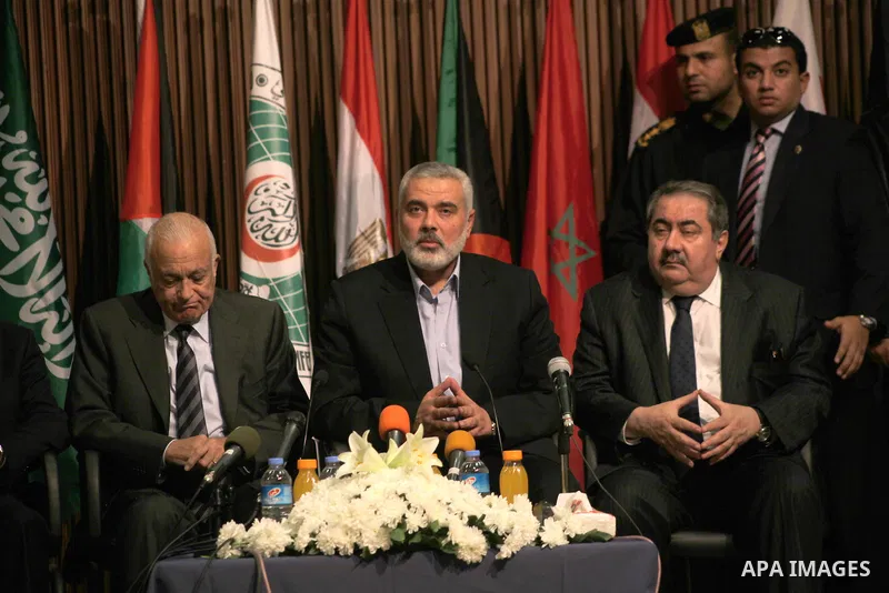 Arab League General Secretary Nabil al-Arabi and Turkish Foreign Minister Ahmet Davutoglu meet with Palestinian prime minister in Gaza Strip, Ismail Haniya in Gaza city, Tuesday, Nov. 20, 2012. Turkey's foreign minister...