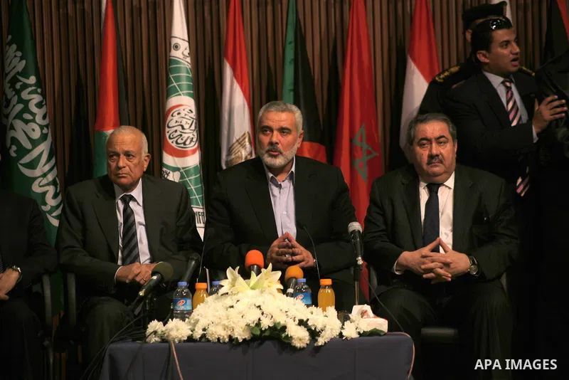 Arab League General Secretary Nabil al-Arabi and Turkish Foreign Minister Ahmet Davutoglu meet with Palestinian prime minister in Gaza Strip, Ismail Haniya in Gaza city, Tuesday, Nov. 20, 2012. Turkey's foreign minister...