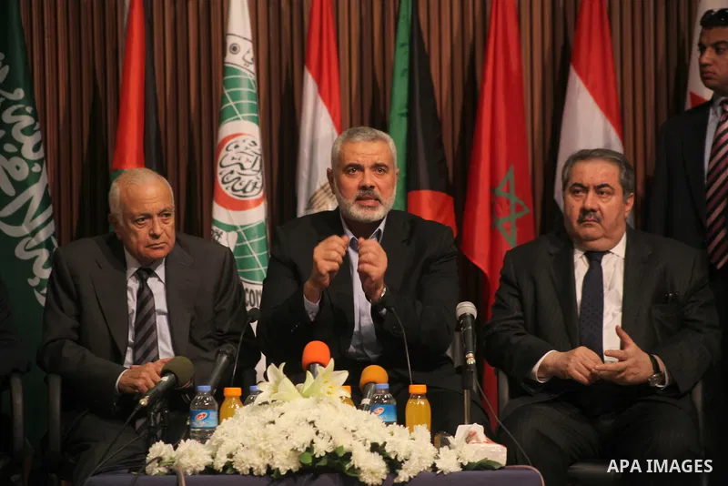 Arab League General Secretary Nabil al-Arabi and Turkish Foreign Minister Ahmet Davutoglu meet with Palestinian prime minister in Gaza Strip, Ismail Haniya in Gaza city, Tuesday, Nov. 20, 2012. Turkey's foreign minister...