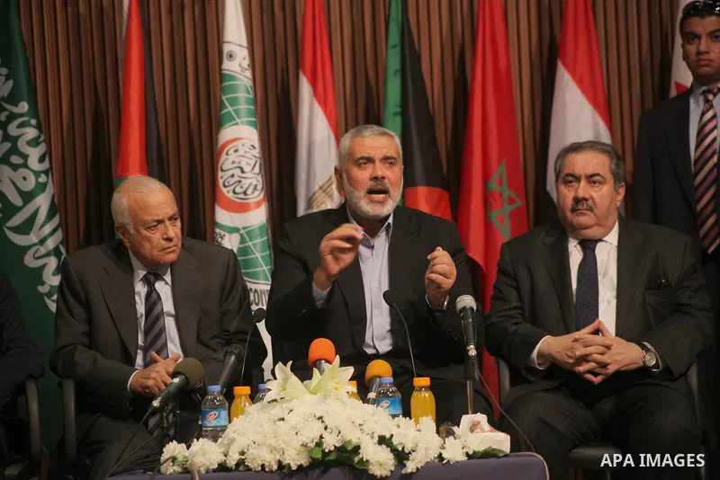 Arab League General Secretary Nabil al-Arabi and Turkish Foreign Minister Ahmet Davutoglu meet with Palestinian prime minister in Gaza Strip, Ismail Haniya in Gaza city, Tuesday, Nov. 20, 2012. Turkey's foreign minister...