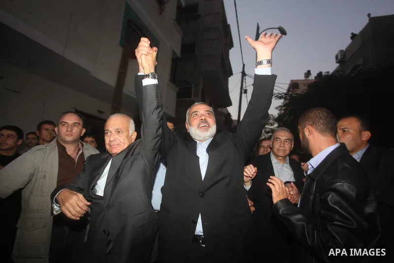 Arab League General Secretary Nabil al-Arabi and Turkish Foreign Minister Ahmet Davutoglu meet with Palestinian prime minister in Gaza Strip, Ismail Haniya in Gaza city, Tuesday, Nov. 20, 2012. Turkey's foreign minister...