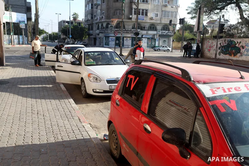 A TV car waits in a street in Gaza city, on November 20, 2012. Two Palestinian journalists were killed in an Israeli airstrike on Gaza City Tuesday evening, after media buildings were hit by Israeli warplanes two days in...