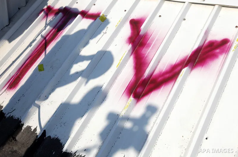 A Photograph shows letters "TV" on the roof of a building in Gaza city, on November 20, 2012. Two Palestinian journalists were killed in an Israeli airstrike on Gaza City Tuesday evening, after media buildings were hit b...