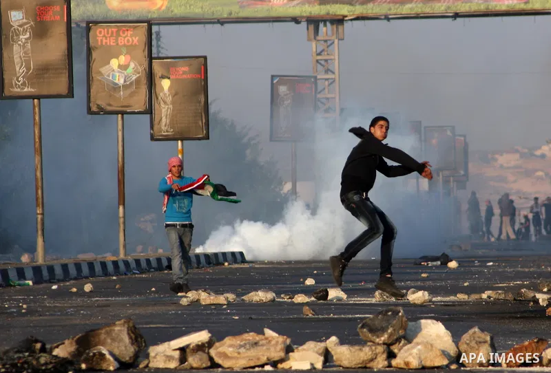 Palestinian protesters throw stones at Israeli soldiers during clashes in the West Bank city of Nablus, on November 20, 2012. The West Bank has witnessed almost daily demonstrations in support of Gaza Palestinians who ha...