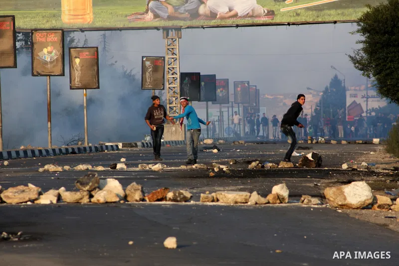 Palestinian protesters throw stones at Israeli soldiers during clashes in the West Bank city of Nablus, on November 20, 2012. The West Bank has witnessed almost daily demonstrations in support of Gaza Palestinians who ha...