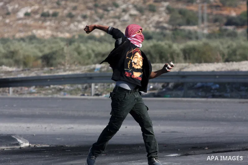 Palestinian protesters throw stones at Israeli soldiers during clashes in the West Bank city of Nablus, on November 20, 2012. The West Bank has witnessed almost daily demonstrations in support of Gaza Palestinians who ha...