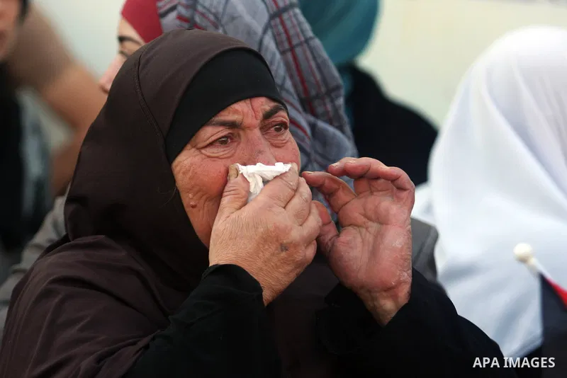 Relatives grieve Rushdi Tamimi who died of injuries sustained during clashes Saturday with Israeli security, during his funeral in the West Bank city of Ramallah, Tuesday, Nov 20, 2012. Tamimi was wounded during a protes...