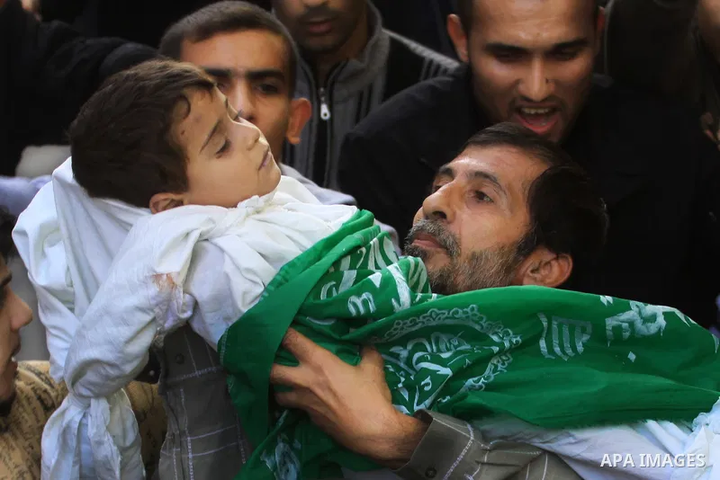 Palestinians carry the bodies of brothers Suhaib, 2-years-old, and Mohammed Hejazi, 4-years-old, during their funeral in the northern Gaza Strip area of Biet Lahia, on November 20, 2012. Four members of the Hejazi family...