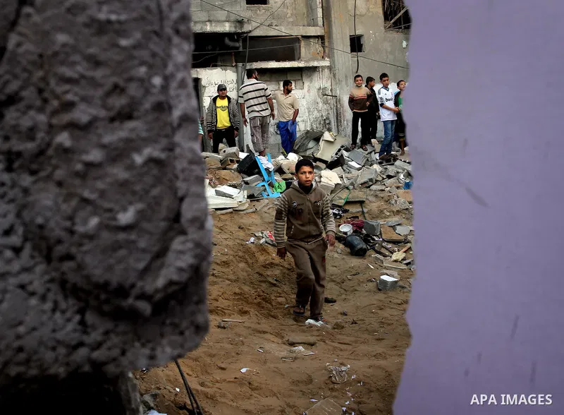 Palestinians inspect the damage after an Israeli air strike on a house in Gaza City on November 20, 2012. Israeli leaders discussed an Egyptian plan for a truce with Gaza's ruling Hamas, reports said, before a mission by...