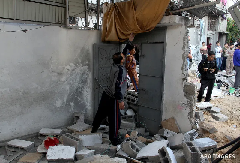 Palestinians inspect the damage after an Israeli air strike on a house in Gaza City on November 20, 2012. Israeli leaders discussed an Egyptian plan for a truce with Gaza's ruling Hamas, reports said, before a mission by...