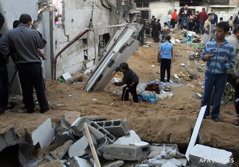 Palestinians inspect the damage after an Israeli air strike on a house in Gaza City on November 20, 2012. Israeli leaders discussed an Egyptian plan for a truce with Gaza's ruling Hamas, reports said, before a mission by...