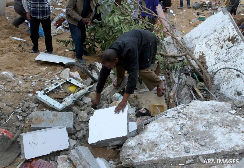 Palestinians inspect the damage after an Israeli air strike on a house in Gaza City on November 20, 2012. Israeli leaders discussed an Egyptian plan for a truce with Gaza's ruling Hamas, reports said, before a mission by...