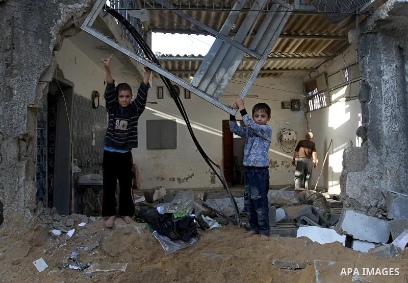 Palestinians inspect the damage after an Israeli air strike on a house in Gaza City on November 20, 2012. Israeli leaders discussed an Egyptian plan for a truce with Gaza's ruling Hamas, reports said, before a mission by...