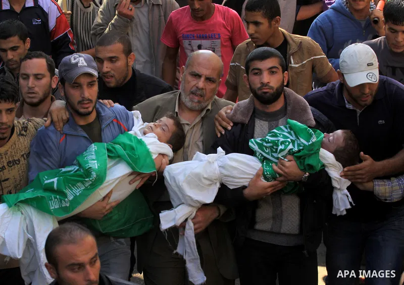 Palestinians carry the bodies of brothers Suhaib, 2-years-old, and Mohammed Hejazi, 4-years-old, during their funeral in the northern Gaza Strip area of Biet Lahia, on November 20, 2012. Four members of the Hejazi family...