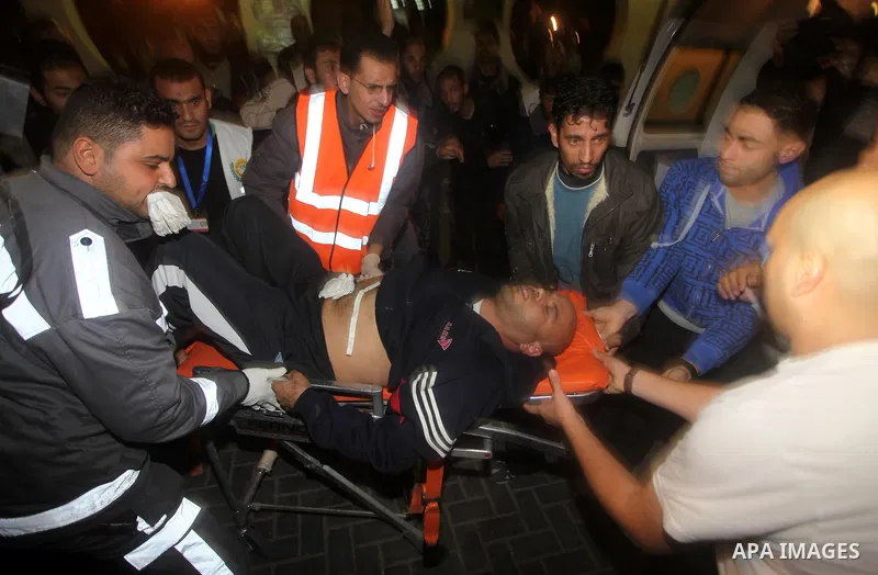 Palestinian medics wheel a wounded man after an Israeli airstrike in Gaza city, on November 21, 2012. Israeli leaders discussed an Egyptian plan for a truce with Gaza's ruling Hamas, reports said, before a mission by the...