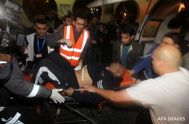 Palestinian medics wheel a wounded man after an Israeli airstrike in Gaza city, on November 21, 2012. Israeli leaders discussed an Egyptian plan for a truce with Gaza's ruling Hamas, reports said, before a mission by the...