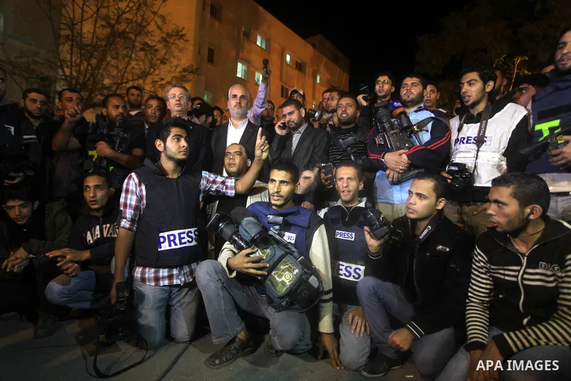 Palestinian photographers gather at al-Shifa hospital during a protest against Israeli raids on Palestinian journalists in Gaza city on November 20, 2012. Two cameramen from Hamas-owned Al-Aqsa TV were among six people k...