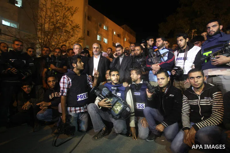 Palestinian photographers gather at al-Shifa hospital during a protest against Israeli raids on Palestinian journalists in Gaza city on November 20, 2012. Two cameramen from Hamas-owned Al-Aqsa TV were among six people k...