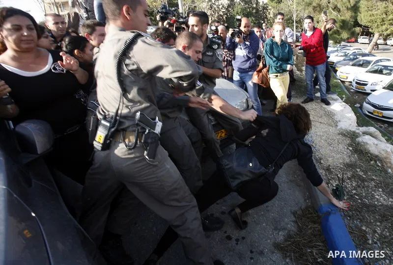 Israeli soldiers arrest a Palestinian protester during a Palestinian protest at Hebrew University in Jerusalem, 20 November 2012, showing solidarity with the Palestinians in the Gaza Strip, as hostilities continue on the...