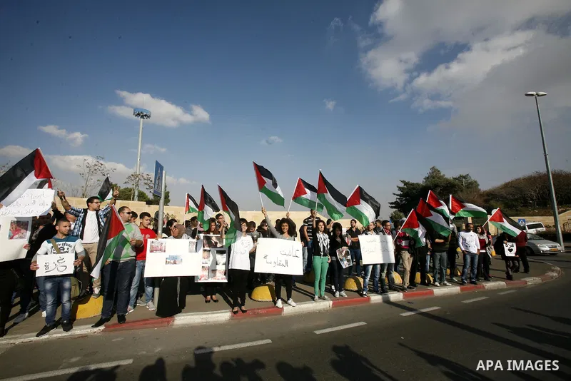 Palestinian protestors and Israelis shout slogans during a protest in Hebrew University in Jerusalem's Old City 20 November 2012, showing solidarity with the Palestinians in the Gaza Strip, as hostilities continue on the...