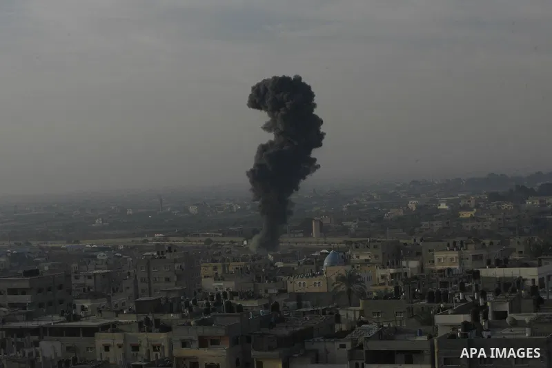 Smoke rises following an Israeli strike on smuggling tunnels along the border between Egypt and Rafah southern Gaza Strip, Wednesday, Nov. 21, 2012. Israeli aircraft pounded Gaza with at least 30 strikes overnight, hitti...