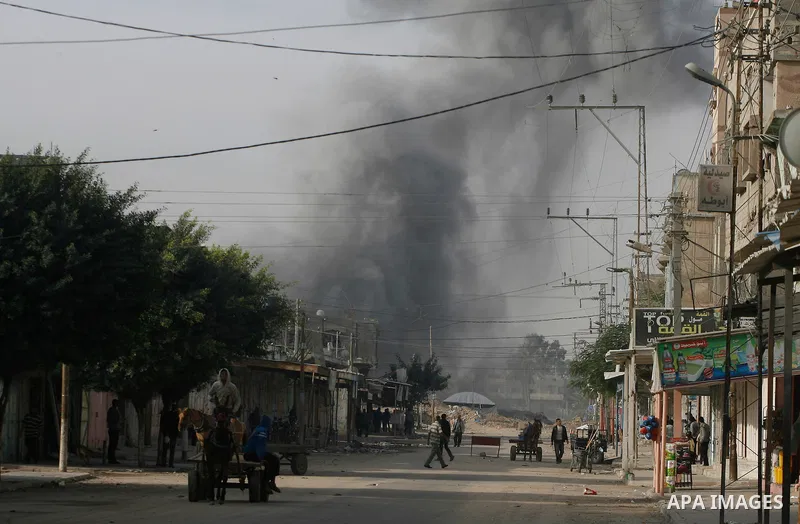 Smoke rises following an Israeli strike on smuggling tunnels along the border between Egypt and Rafah southern Gaza Strip, Wednesday, Nov. 21, 2012. Israeli aircraft pounded Gaza with at least 30 strikes overnight, hitti...