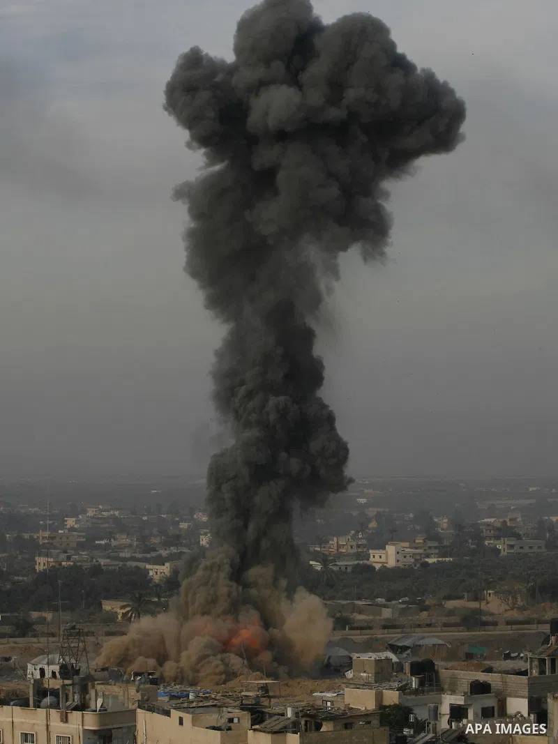 Smoke rises following an Israeli strike on smuggling tunnels along the border between Egypt and Rafah southern Gaza Strip, Wednesday, Nov. 21, 2012. Israeli aircraft pounded Gaza with at least 30 strikes overnight, hitti...