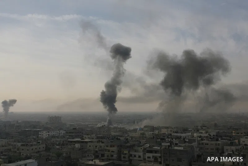 Smoke rises following an Israeli strike on smuggling tunnels along the border between Egypt and Rafah southern Gaza Strip, Wednesday, Nov. 21, 2012. Israeli aircraft pounded Gaza with at least 30 strikes overnight, hitti...