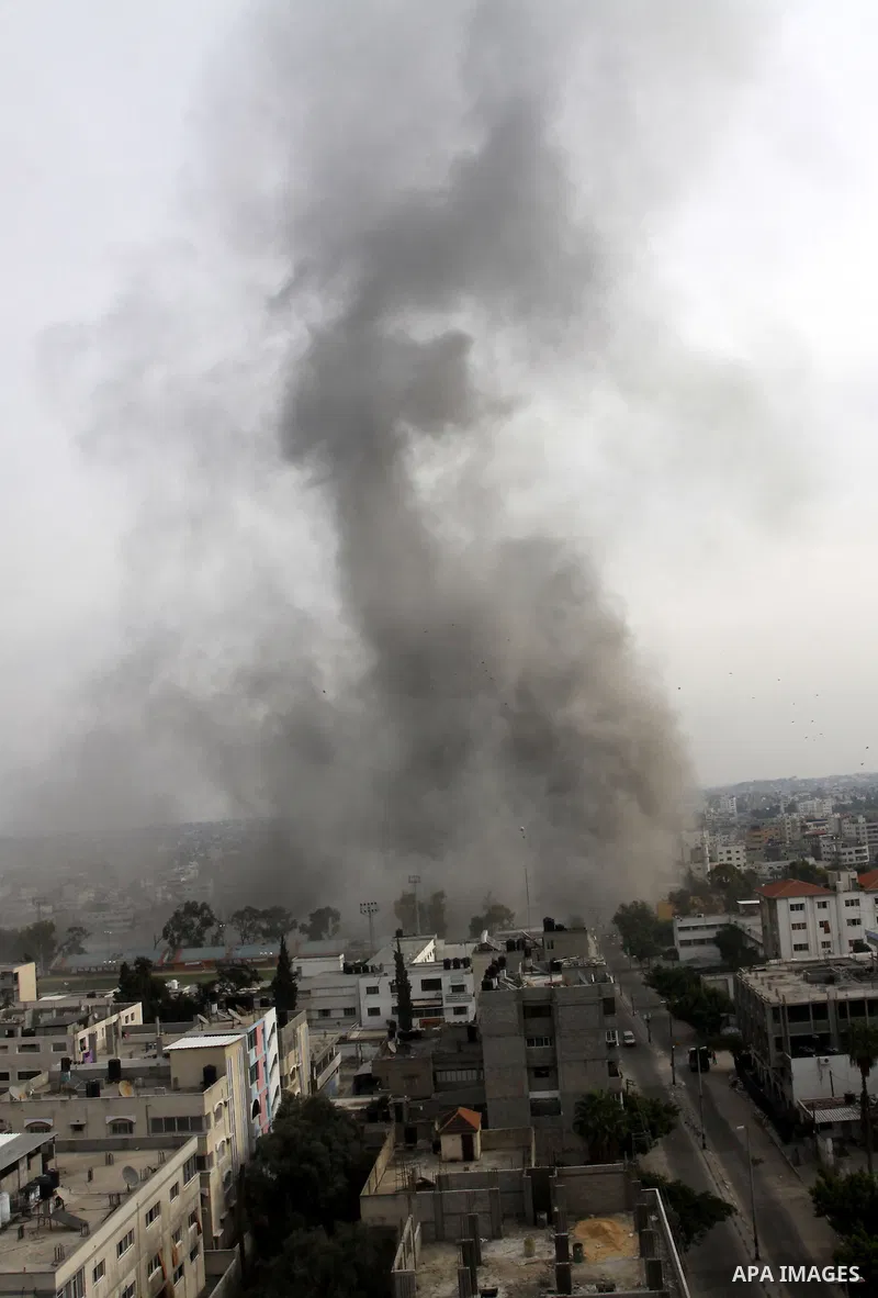 Smoke raises after an Israeli air strike in Gaza City, Wednesday, Nov. 21, 2012. Israeli aircraft pounded Gaza with at least 30 strikes overnight, hitting government ministries, smuggling tunnels, a banker's empty villa...