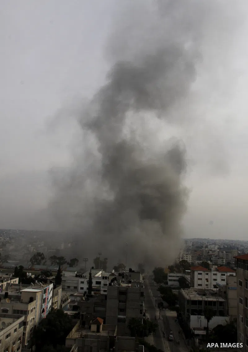 Smoke raises after an Israeli air strike in Gaza City, Wednesday, Nov. 21, 2012. Israeli aircraft pounded Gaza with at least 30 strikes overnight, hitting government ministries, smuggling tunnels, a banker's empty villa...