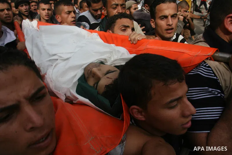 Palestinian mourners carry the bodies of five Palestinians killed in Israeli strikes during their funeral in Rafah, southern Gaza Strip, Wednesday, Nov. 21, 2012. U.S. Secretary of State Hillary Rodham Clinton shuttled b...