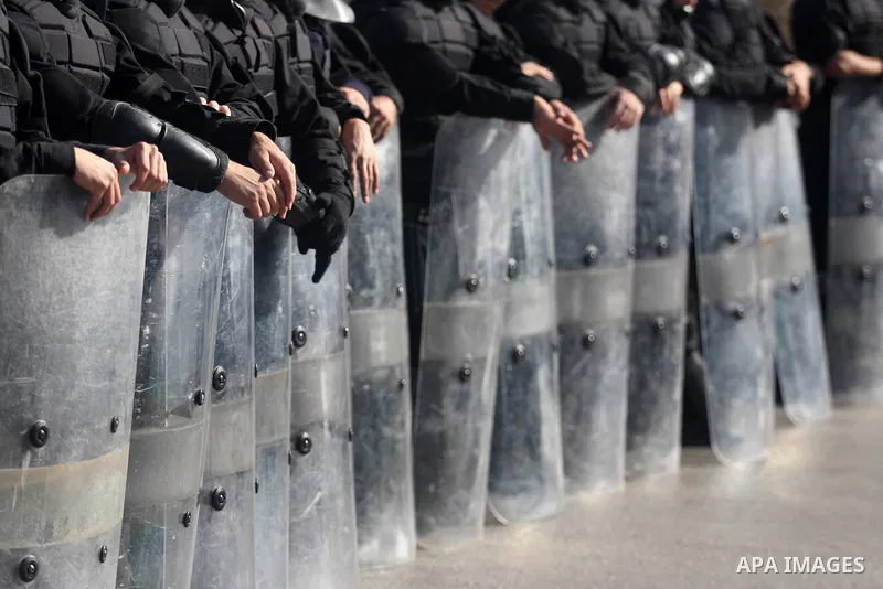 Members of the Palestinian security forces stand guard as a protest is held during the visit of U.S. Secretary of State Hillary Clinton in the West Bank city of Ramallah November 21, 2012. Israeli air strikes shook the G...