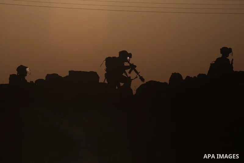 Israeli border policemen hold their weapons as silhouetted during clashes with stone-throwing Palestinians in the West Bank village in Nabi Saleh, near Ramallah November 20, 2012. Two funeral processions for Palestinians...