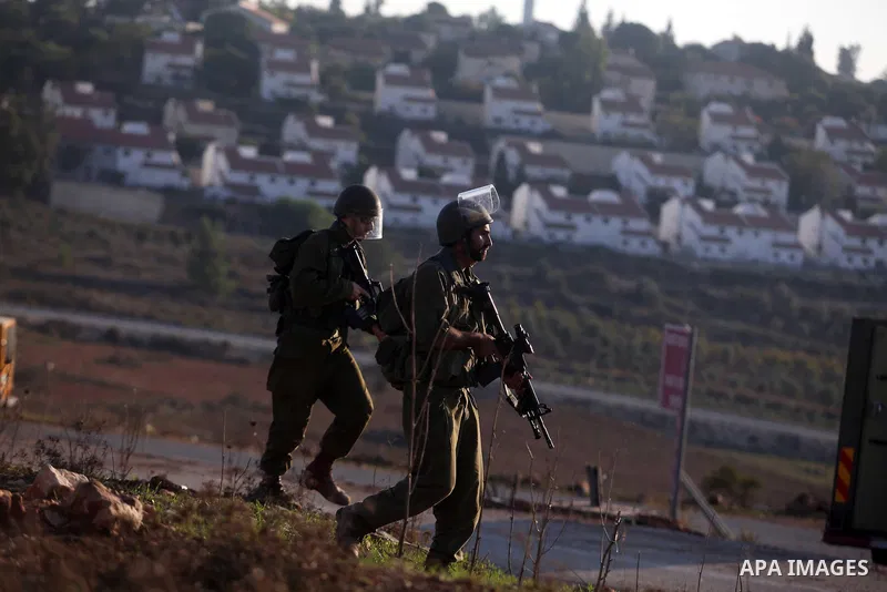 Israeli security forces shoot at Palestinian protesters during clashes in the West Bank village in Nabi Saleh, near Ramallah November 20, 2012. Two funeral processions for Palestinians killed during clashes with the Isra...