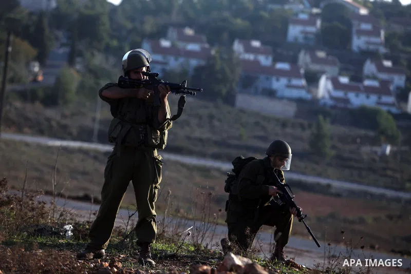 Israeli security forces shoot at Palestinian protesters during clashes in the West Bank village in Nabi Saleh, near Ramallah November 20, 2012. Two funeral processions for Palestinians killed during clashes with the Isra...