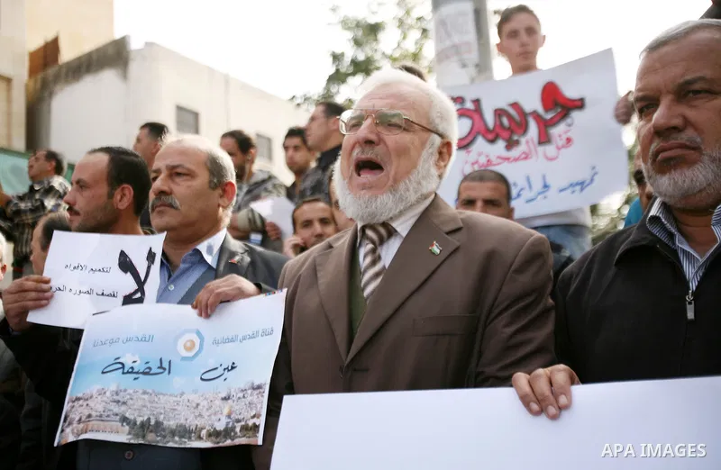 Aziz Dweik (C) Speaker of the Palestinian Legislative Council and a representative of the Hamas movment joins a protest against the Israeli targeting the Gazans media members, in the West Bank city of Hebron, November 21...