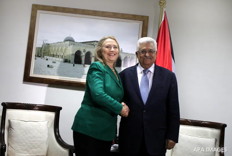 U.S. Secretary of State Hillary Rodham Clinton, shakes hands with Palestinian President Mahmoud Abbas during a meeting in the West Bank city of Ramallah, Wednesday, Nov. 21, 2012. Clinton will try on Wednesday to wring a...