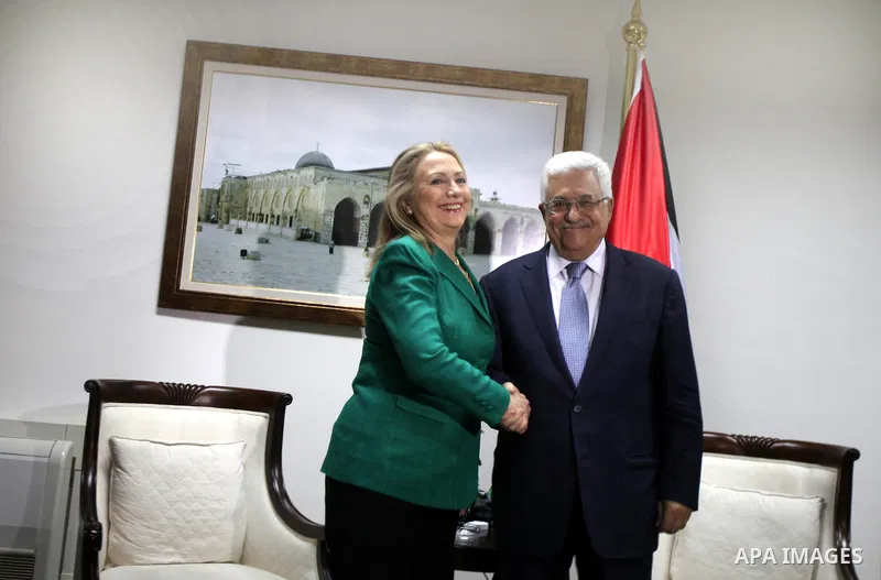 U.S. Secretary of State Hillary Rodham Clinton, shakes hands with Palestinian President Mahmoud Abbas during a meeting in the West Bank city of Ramallah, Wednesday, Nov. 21, 2012. Clinton will try on Wednesday to wring a...
